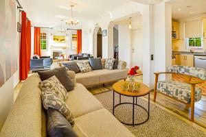 a living room with a couch and a table at Summerdays in the Med in Fethiye