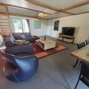 a living room with a couch and a coffee table at Kromven in Merksplas