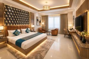 a hotel room with a bed and a television at Hotel Velocity Near Terminal 3 Delhi International Airport With- Free Pickup in New Delhi