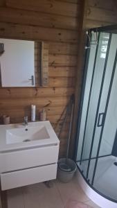 a bathroom with a sink and a shower and a tub at bungalow détente in Capesterre-Belle-Eau