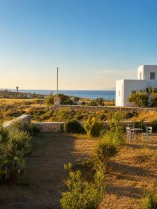 a garden with a view of the ocean at Aphrodite's Villa in Ambelas