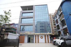 a building with a sign that reads hotel evolutionary coefficient at Hotel Banyan Courtyard Guwahati in Guwahati