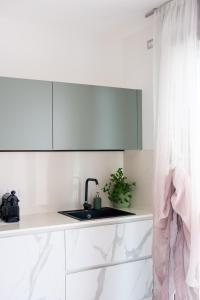a kitchen with a sink and a counter top at Ca'vio Beach Pool in Cavallino-Treporti
