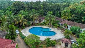 an aerial view of a house with a swimming pool at Luxury 2BHK Villa Near Anjuna Beach, North Goa in Anjuna