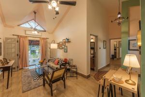 a living room with a couch and a table at Luxury 2BHK Villa Near Anjuna Beach, North Goa in Anjuna