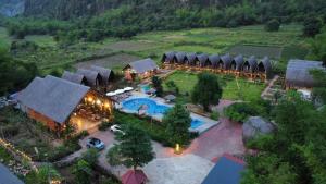 an aerial view of a resort with a pool and tents at Cat Ba Holiday Retreat in Cat Ba