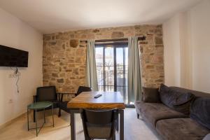 a living room with a couch and a table at Shire Küçükköy in Ayvalık