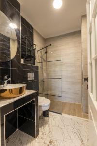 a bathroom with a sink and a toilet and a shower at Shire Küçükköy in Ayvalık +87 photos