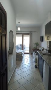 a kitchen with a view of a living room at Cabo Dream 51 in Cabo Negro