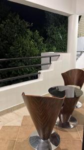 two brown vases sitting on top of a balcony at زهرة الهدا in Al Hada