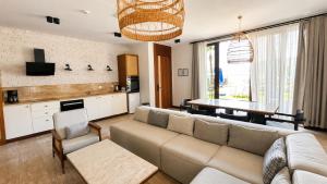 a living room with a couch and a table at İskelem Otel in Akyaka