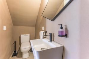 a bathroom with a sink and a toilet at Happy Cactus 1BR Apartment In Batroun Souks in Batroûn +17 photos