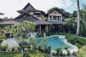 an image of a house with a swimming pool in front of it at Casa Magick boutique Villa in Gili Islands