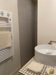 a bathroom with a white tub and a sink at Maison Caramel in Condorcet +39 photos