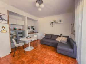 a living room with a couch and a table at La La Land in Letojanni