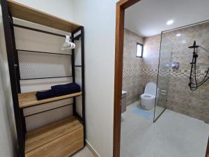 a small bathroom with a shower and a toilet at Palm Garden Villa Aonang in Ao Nam Mao +71 photos