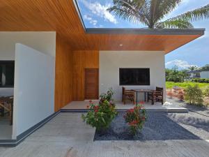 a modern house with a glass roof at Palm Garden Villa Aonang in Ao Nam Mao