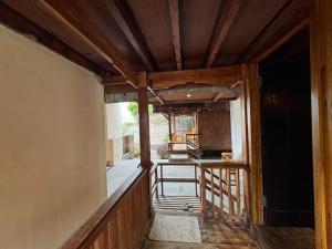 a view of a kitchen from the hallway of a house at Nona Lodge in Tetebatu