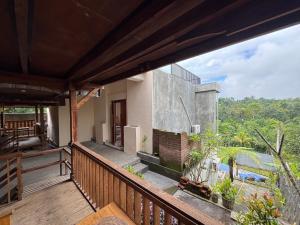 a view from the balcony of a house at Nona Lodge in Tetebatu