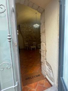 an open door to a hallway with a table at MaryClouBert-Home in Molfetta