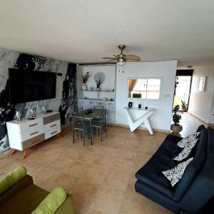 a living room with a couch and a table at Troya 701 in Gaira