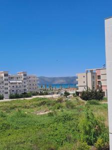 a view of the beach in a city at Mimosa Apartment in Vlorë