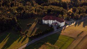 an aerial view of a large house in a field at Leonardo Med Spa Resort in Nondorf