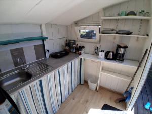 an aerial view of a kitchen in a tiny house at Maisonnette mitoyenne andernos in Andernos-les-Bains