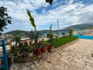 a view from the roof of a house with potted plants at Zoi's sea view in Himare