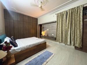 a bedroom with a bed and a window at Entire 2Bhk Flat with a big Balcony in Jaipur