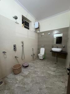 a bathroom with a toilet and a sink at Entire 2Bhk Flat with a big Balcony in Jaipur +15 photos