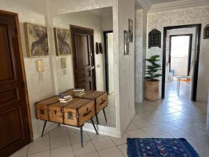 a room with a table with a trunk in it at Beach apartment down town in Agadir