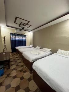 เตียงในห้องที่ Bliss Hotel & SPA