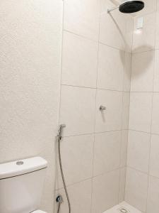 a bathroom with a shower with a toilet at Hotel Confort in Quixadá