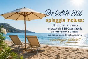 a beach with two chairs and an umbrella at La Casa di Isabella Loreto in Loreto