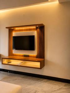 a flat screen tv on a wall at Vianara's Eco Feel Resort in Jaipur