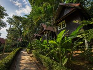 a house in the middle of a garden at Vanara Resort in Ko Chang