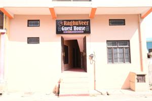 a building with a sign for a guest house at Shri Raghuveer guest house in Ayodhya