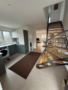 a living room with a spiral staircase in a house at Cozy apartment in Vendenheim in Vendenheim