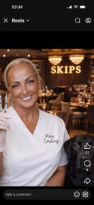 a woman posing with a dog in a restaurant at Skips in Largs