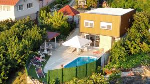 an overhead view of a house with a swimming pool at Green View in Petrovaradin