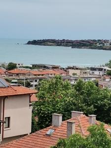 a view of a city with houses and the water at Guest house Villa Stefi in Sozopol