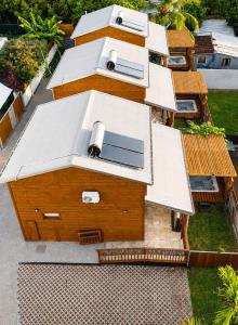 an overhead view of a building with a white roof at Le Cocon d'Ava - Bungalows & Spa in Saint-Paul +5 photos