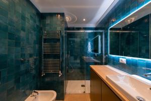 a bathroom with a sink and a shower and a toilet at Marcello's Como Lake - Camerlata in Como +30 photos