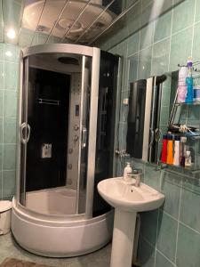 a bathroom with a shower and a sink at Green Hostel in Yerevan +20 photos