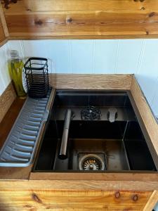 a sink in a kitchen with a counter top at Herdsman's Hideaway on the Wye in Fawley Station