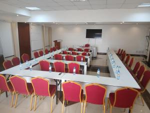a conference room with a long table and chairs at ACK St.Julians Centre in Limuru