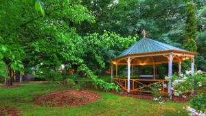 a gazebo in a yard in a park at Chalets Lumineux in Bright