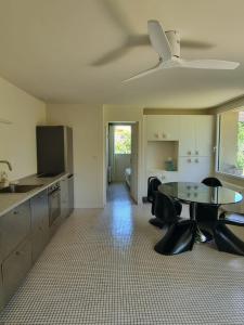 a kitchen and dining room with a table and chairs at Maison Caramel in Condorcet