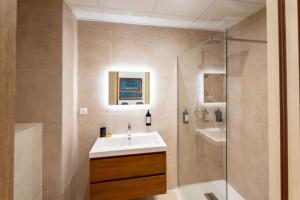 a bathroom with a sink and a shower at Eden Islands Marseille Prado in Marseille +44 photos